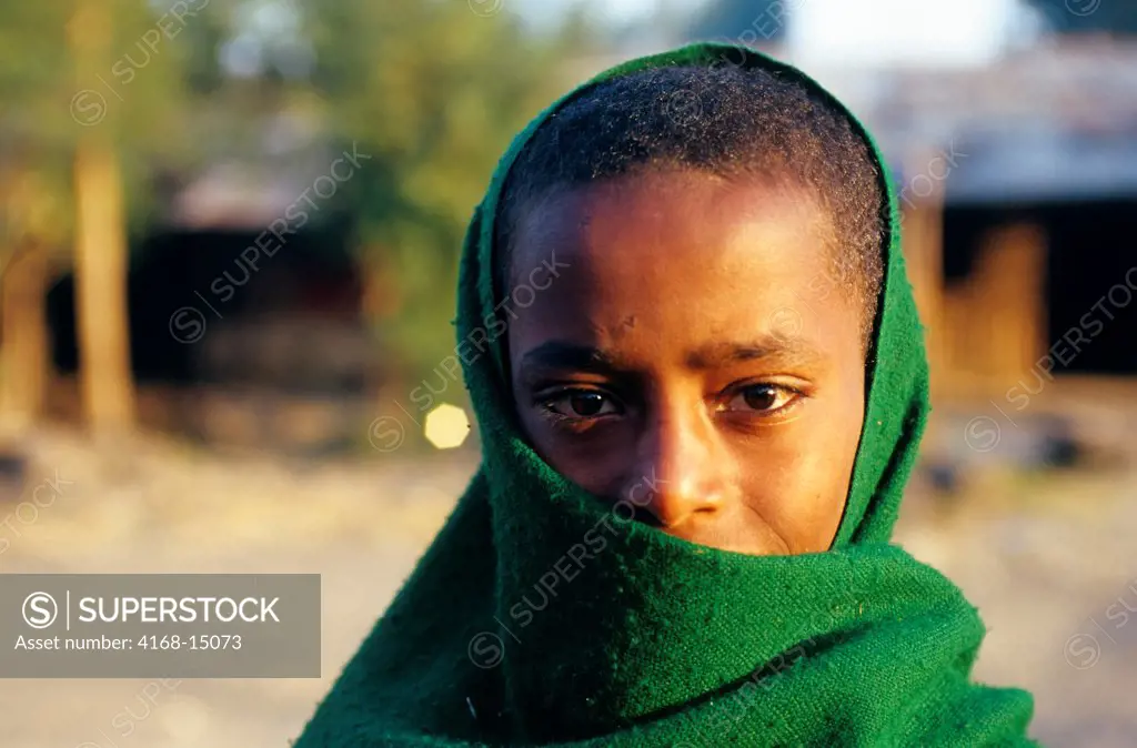 Ethiopia, Near Bahar Dar, Small Village, Boy Draped In Green Cloth
