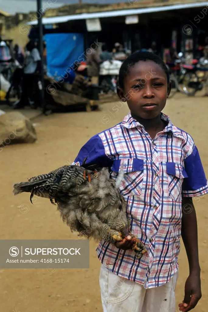 Uganda, Kasese, Street Scene, Boy With Chicken