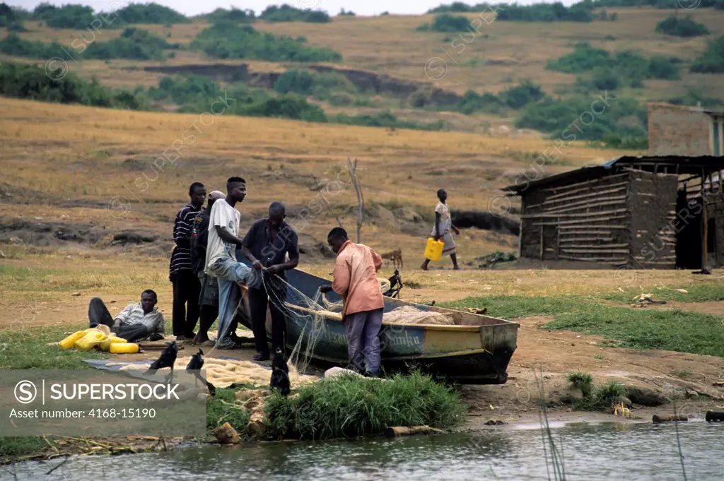 Uganda, Queen Elizabeth National Park, Kazinga Channel, Fishermen Preparing Net