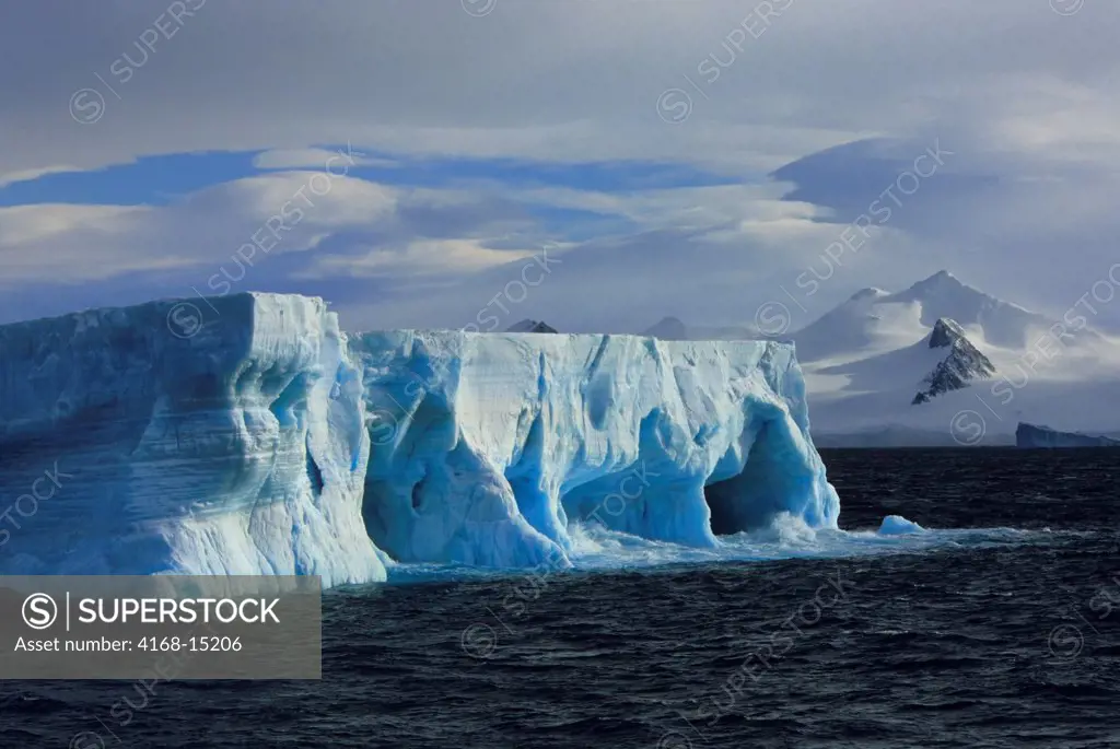 Antarctica,Tabular Iceberg With Caves & Arches, Mt. Bransfield, Antarctic Peninsula Background