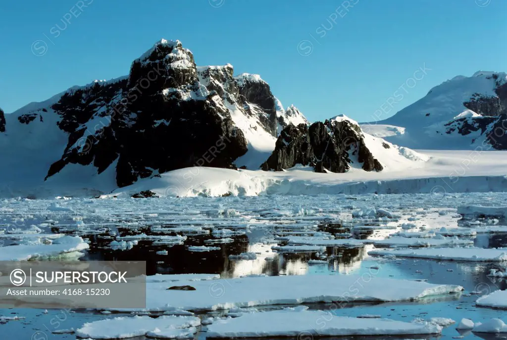 Antarctic Peninsula Area, Mountains And Pack Ice, Leopard Seal On Ice Floe