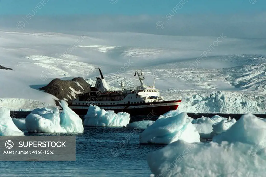 ANTARCTICA, KING GEORGE ISLAND, SOCIETY EXPLORER CRUISE SHIP AT ANCHOR, ICE PEBBLES FOREGROUND
