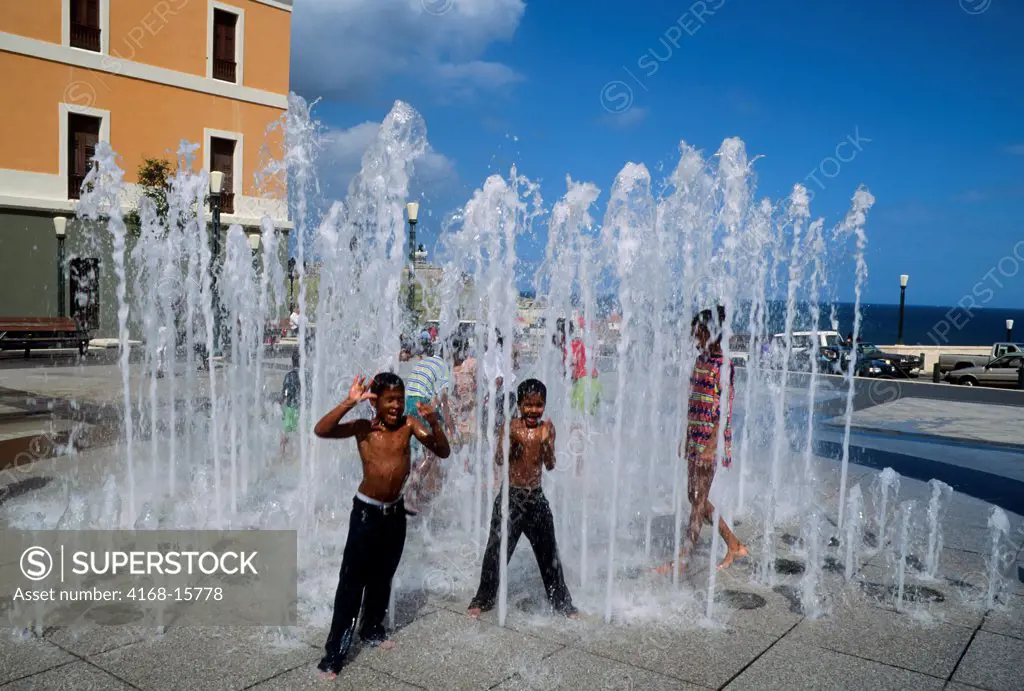 Puerto Rico, Old San Juan, Children Playing In Fountain