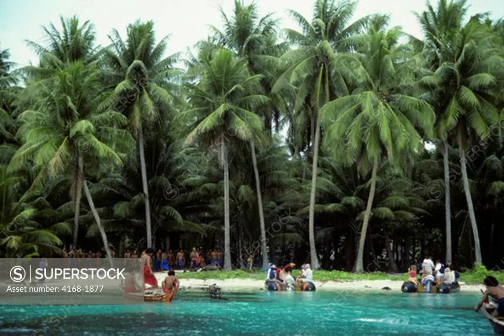 MICRONESIA, CAROLINE ISLS. IFALIK ISLAND, ZODIACS LANDING ON BEACH WITH TOURISTS