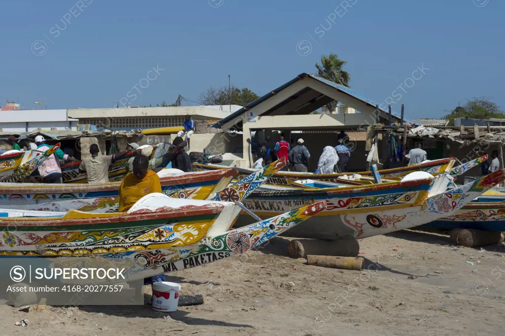 Colorful fishing boats on beach at Soumbedioune, one of the many fishing beaches of Dakar, Senegal, West Africa