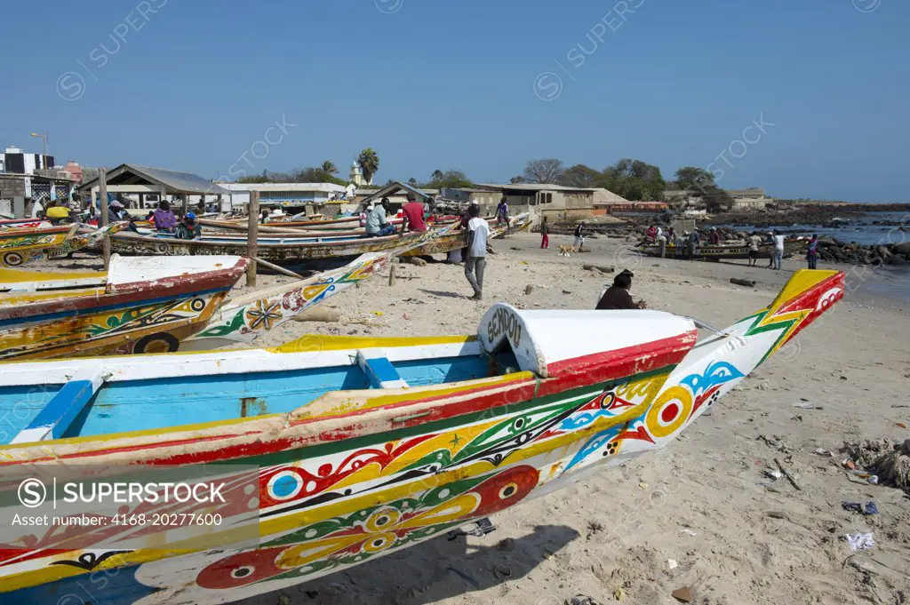 Colorful fishing boats on beach at Soumbedioune, one of the many fishing beaches of Dakar, Senegal, West Africa
