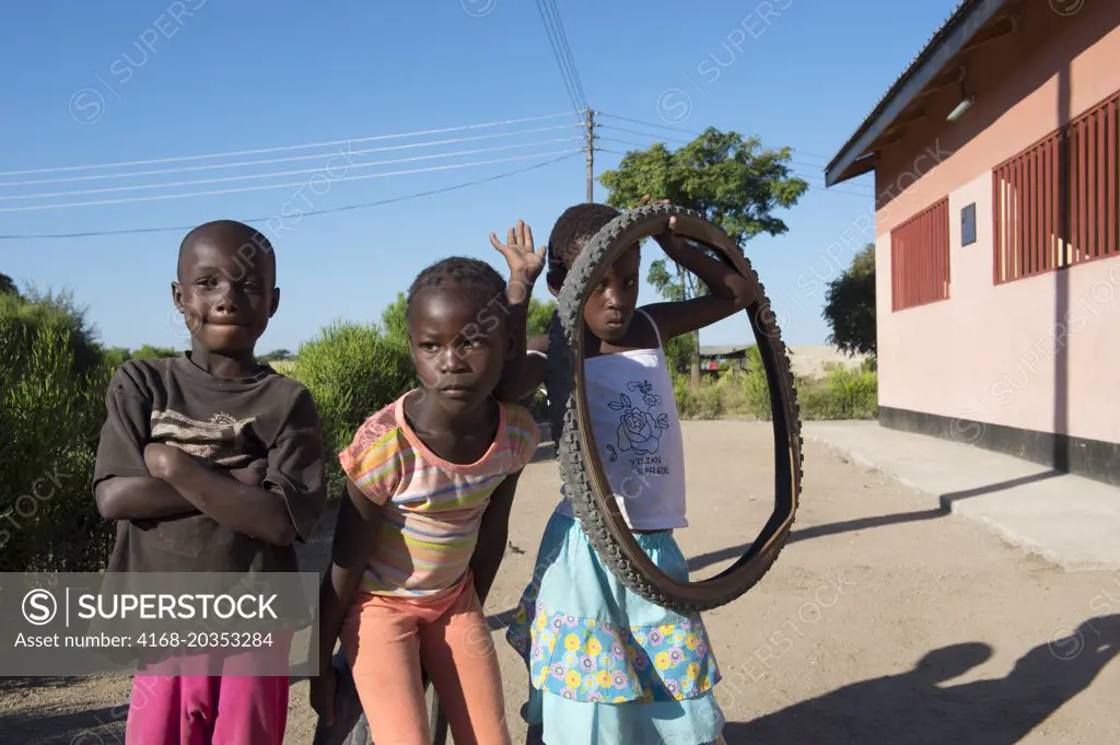 Street scene with local children in a small village near Livingston in Zambia.