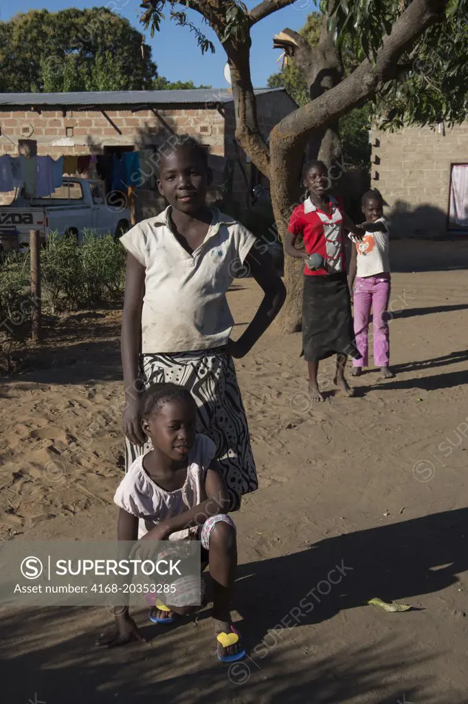 Street scene with local children in a small village near Livingston in Zambia.