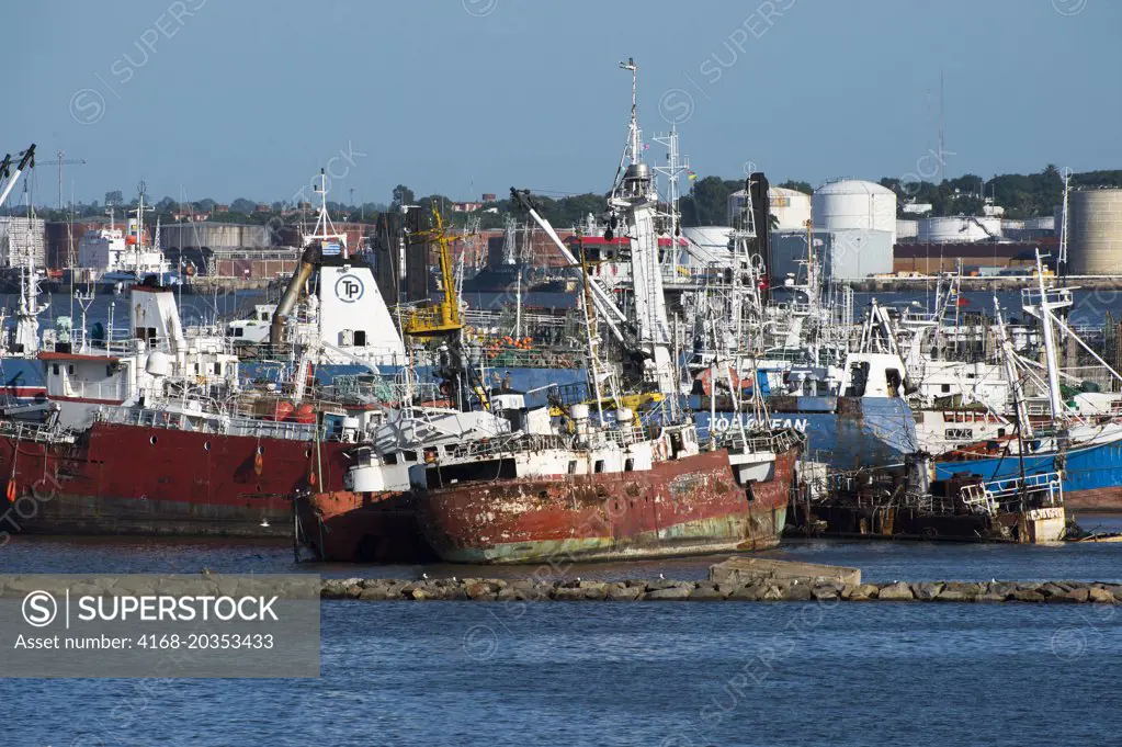 Old ships, some of them sunken, at the entrance of the Montevideo port in Uruguay.