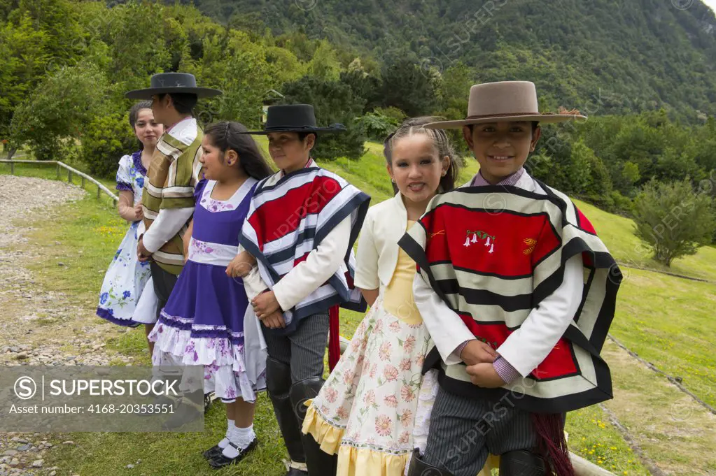 Local children dance group in traditional costumes in Puerto Chacabuco in the Chilean Fjords in southern Chile.