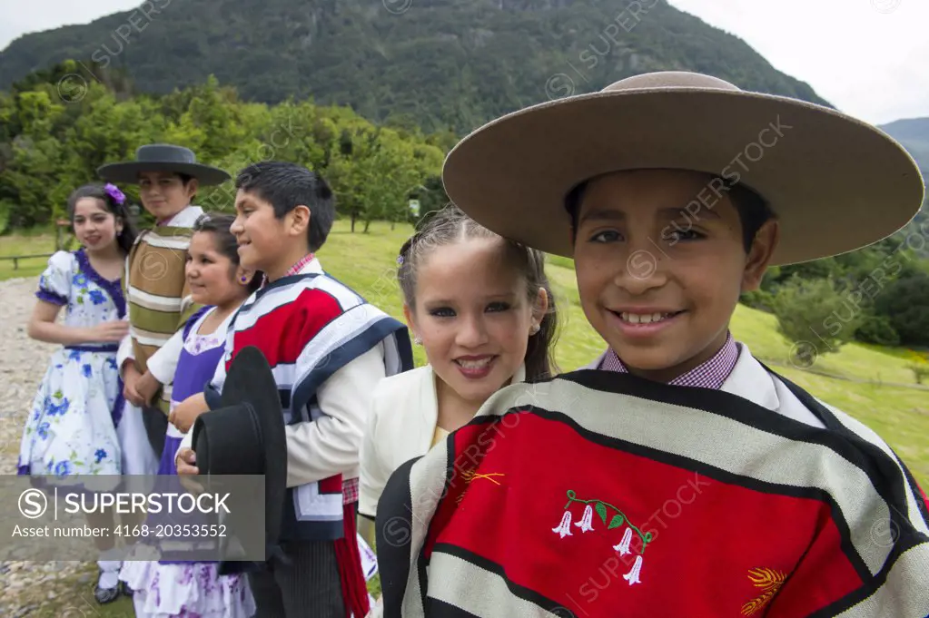 Local children dance group in traditional costumes in Puerto Chacabuco in the Chilean Fjords in southern Chile.