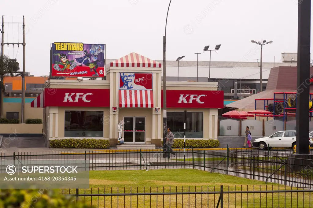 Street scene in Lima, Peru with a KFC (Kentucky Fried Chicken) fast food restaurant.