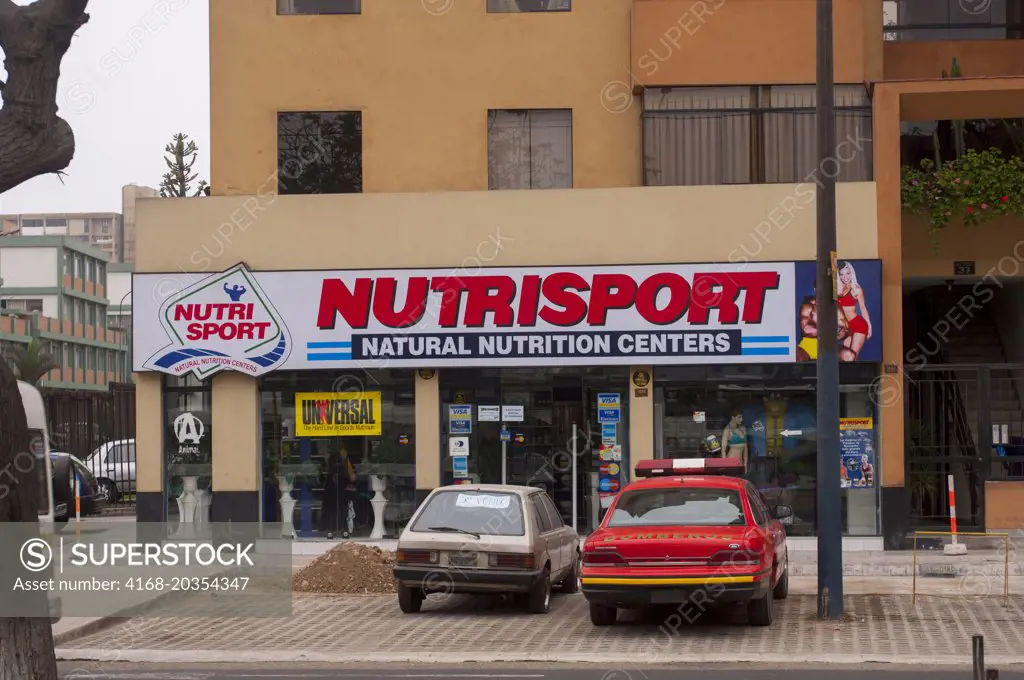 Street scene with nutrition store in Lima, Peru.