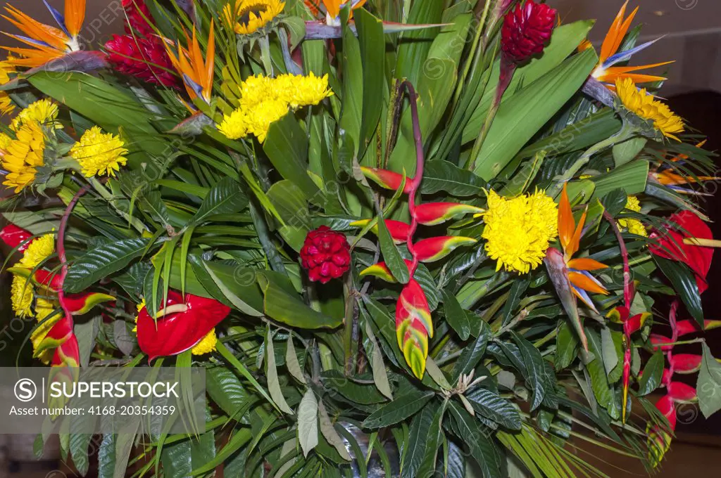 A colorful flower arrangement of tropical flowers in a lobby of a hotel in the center of Lima, Peru.