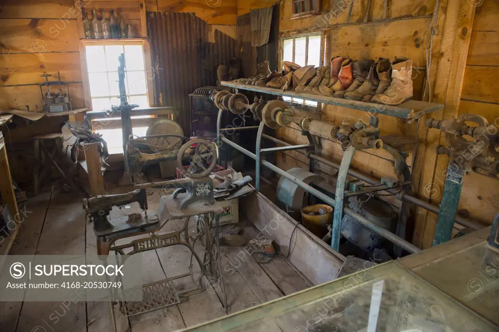 The interior of a shoemaker shop with an old Singer sewing machine at the historic Gold King Mine and Ghost Town from the 1890s outside of Jerome in Arizona, USA.