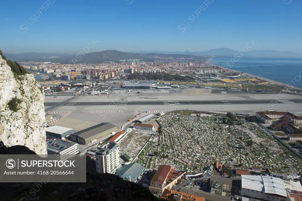 View of the airport and Spain from the World War II tunnels inside of the Rock of Gibraltar, which is a British Overseas Territory, located on the southern end of the Iberian Peninsula at the entrance of the Mediterranean.