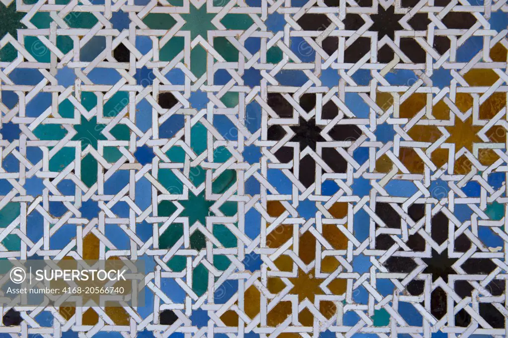 Detail of Moorish architecture (mosaic) in the Alcazar, a royal palace, originally a Moorish fort in Seville, Andalusia, Spain.