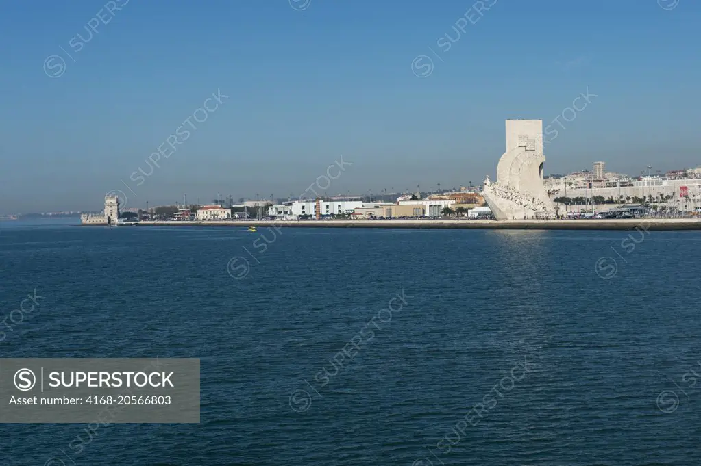 View of the Monument to the Discoveries and the Tower of Belem from the Tagus River in Lisbon, the capital city of Portugal.