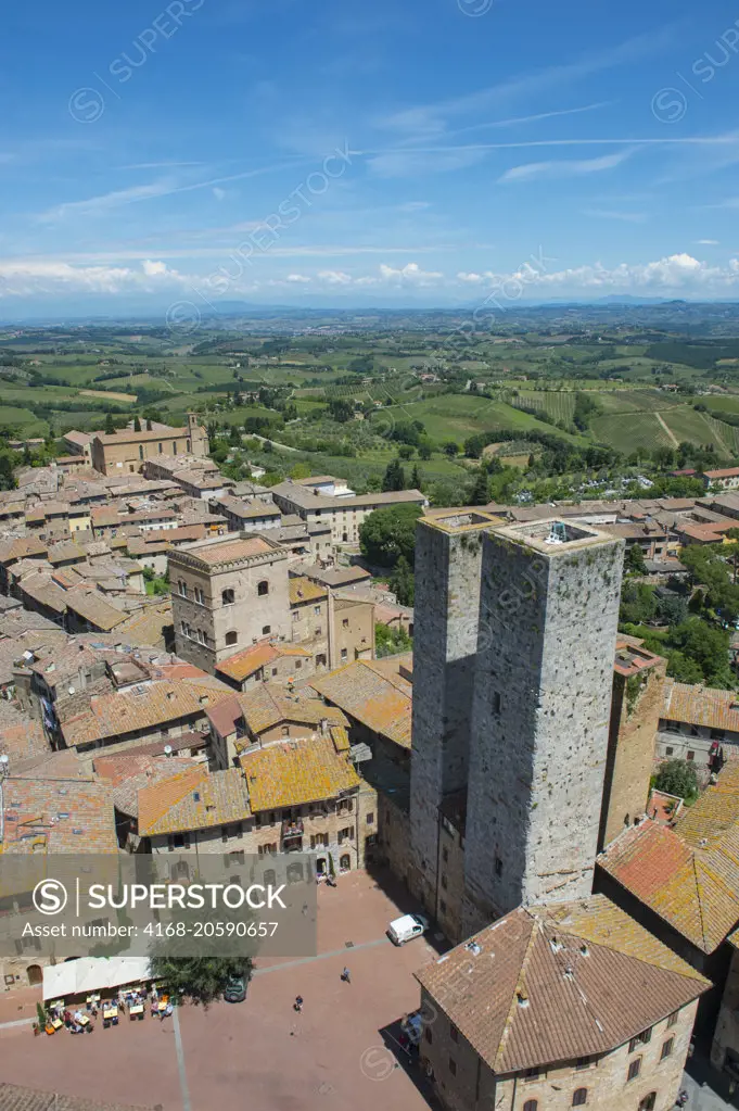 View from a tower of the medieval walled hill town of San Gimignano in Tuscany, Italy and the surrounding landscape.