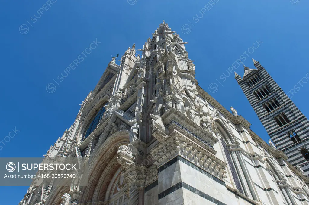 Detail of the Siena Cathedral di Santa Maria, better known as the Duomo, is a medieval marble church in Siena, Tuscany, Italy of Gothic art from the 13th and 14th centuries.