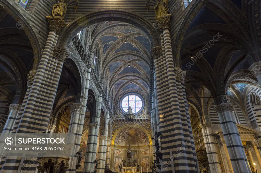 Interior with the rose window of the Siena Cathedral di Santa Maria, better known as the Duomo, in Siena, Tuscany, Italy.