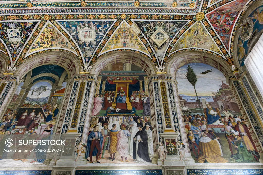 Frescos in the Piccolomini Library in Siena Cathedral di Santa Maria, better known as the Duomo, in Siena, Tuscany, Italy.