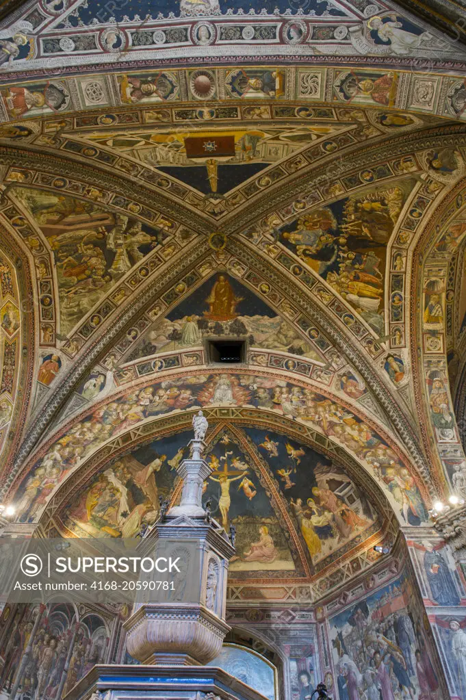 The colorful painted ceiling in the Siena Cathedral Baptistery in Siena, Tuscany, Italy.