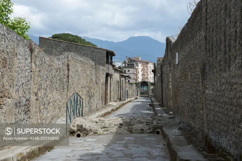 A narrow street of Pompeii near modern Naples in the Italian region of Campania.