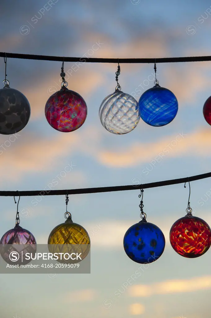 Glass ornaments at sunset in the Pike Place Market in Seattle, Washington State, USA.