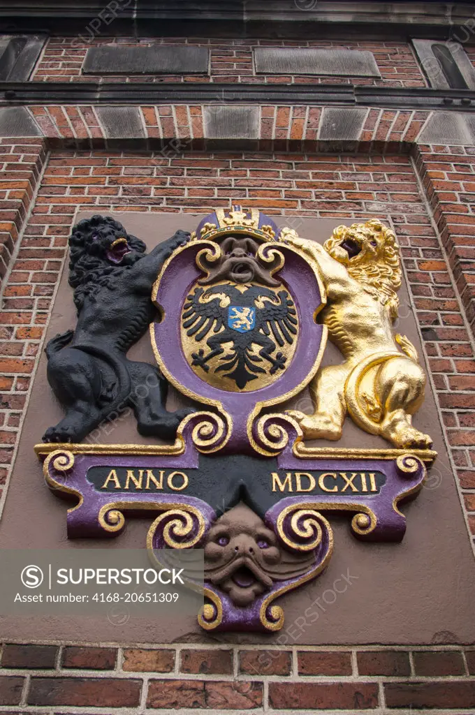 The coat of arms on the old building De Waag, the customs house where they weighed the imported goods to calculate the taxes in Nijmegen in the Netherlands (Holland).