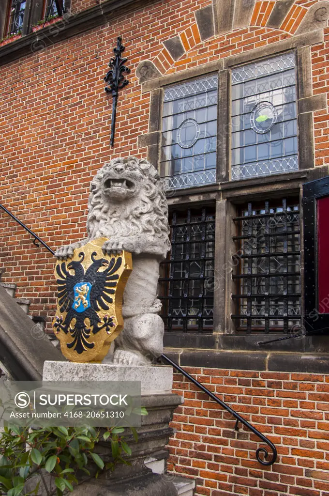 A lion statue in front of the old building De Waag, the customs house where they weighed the imported goods to calculate the taxes in Nijmegen in the Netherlands (Holland).