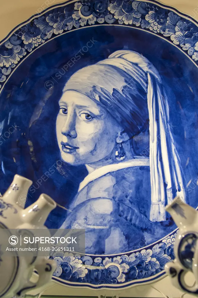 A Delft porcelain plate picturing The Girl with the Pearl Earring in Amsterdam in the Netherlands (Holland).