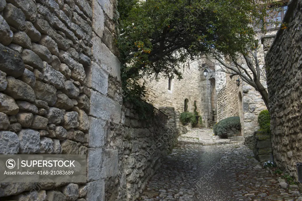 Cobblestone street in the hillside village of Lacoste in the Luberon in the Provence-Alpes-Côte d'Azur region in southeastern France.