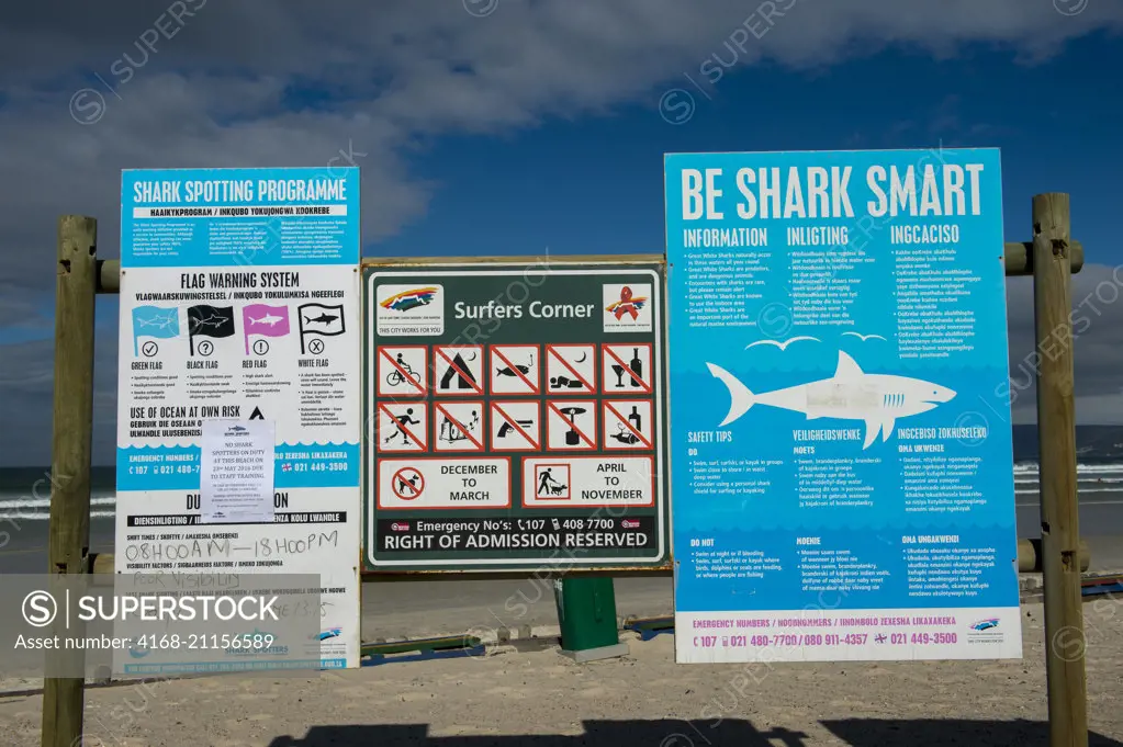 Shark warning signs on the beach at Muizenberg near Cape Town, South Africa.