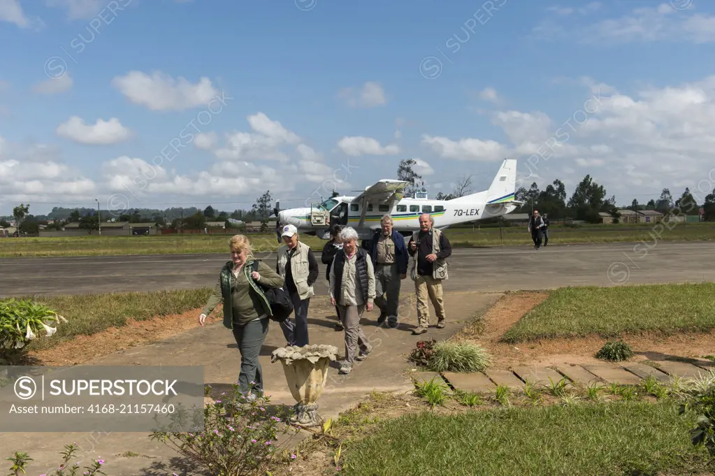 Tourists arriving by a Cessna Caravan at the airport of the small town of Mzuzu in Malawi.
