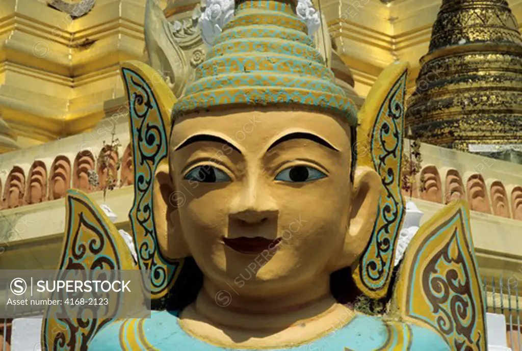 Burma, Rangoon, Golden Stupas Of The Swedagon Pagoda With Big Statue In Foreground