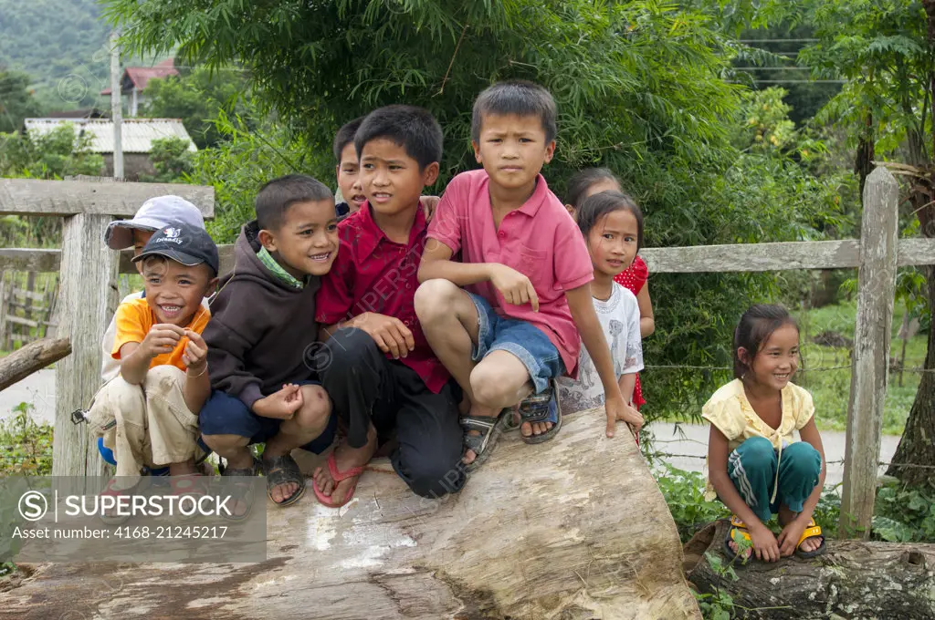 A street scene with children in a village near Phonsavan (originally known as Muang Phouan), the capital of Xiangkhouang province in Laos.