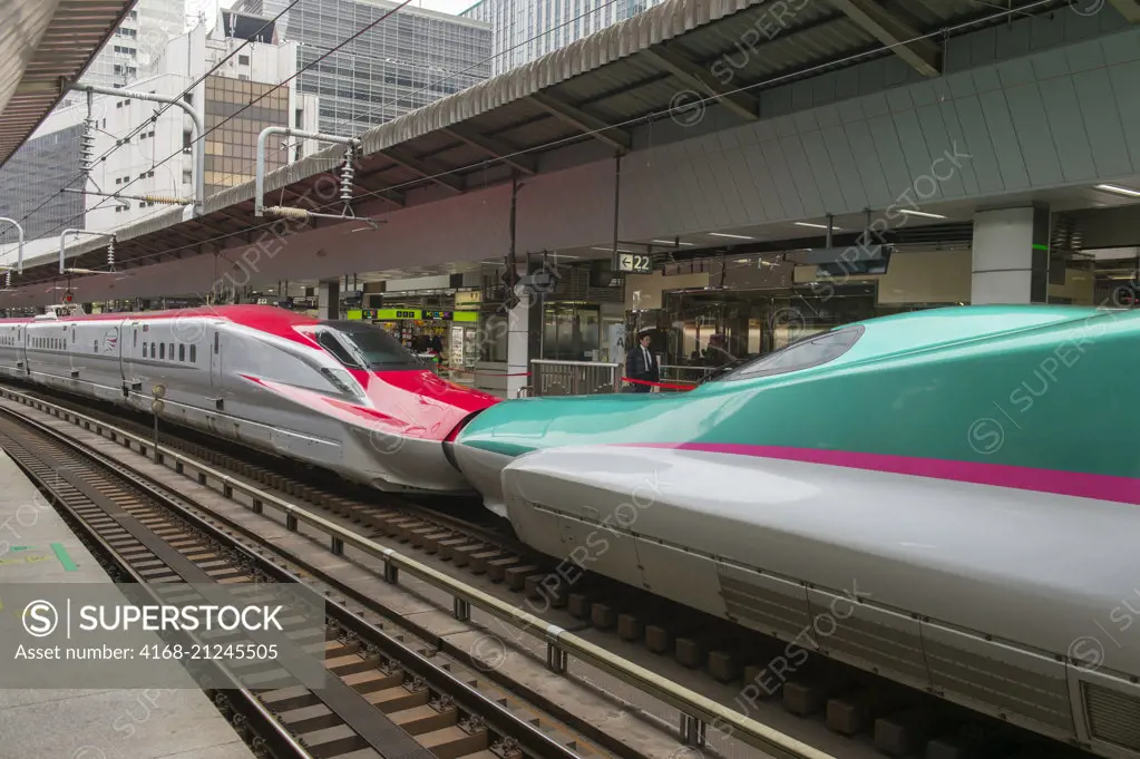 A bullet train (Shinkansen high-speed trains of Japan), is so nicknamed for their appearance and speed, at the Tokyo station, Japan.