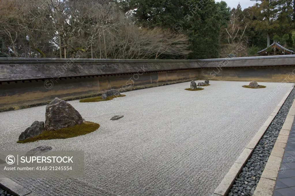 The kare-sansui (dry landscape) Zen rock garden at Ryoan-ji Temple in Kyoto, Japan.