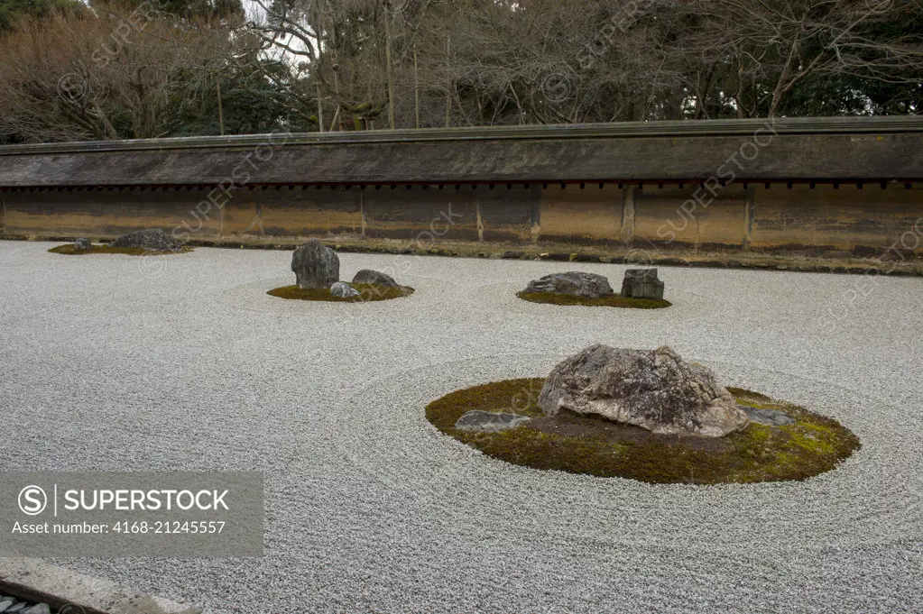 The kare-sansui (dry landscape) Zen rock garden at Ryoan-ji Temple in Kyoto, Japan.