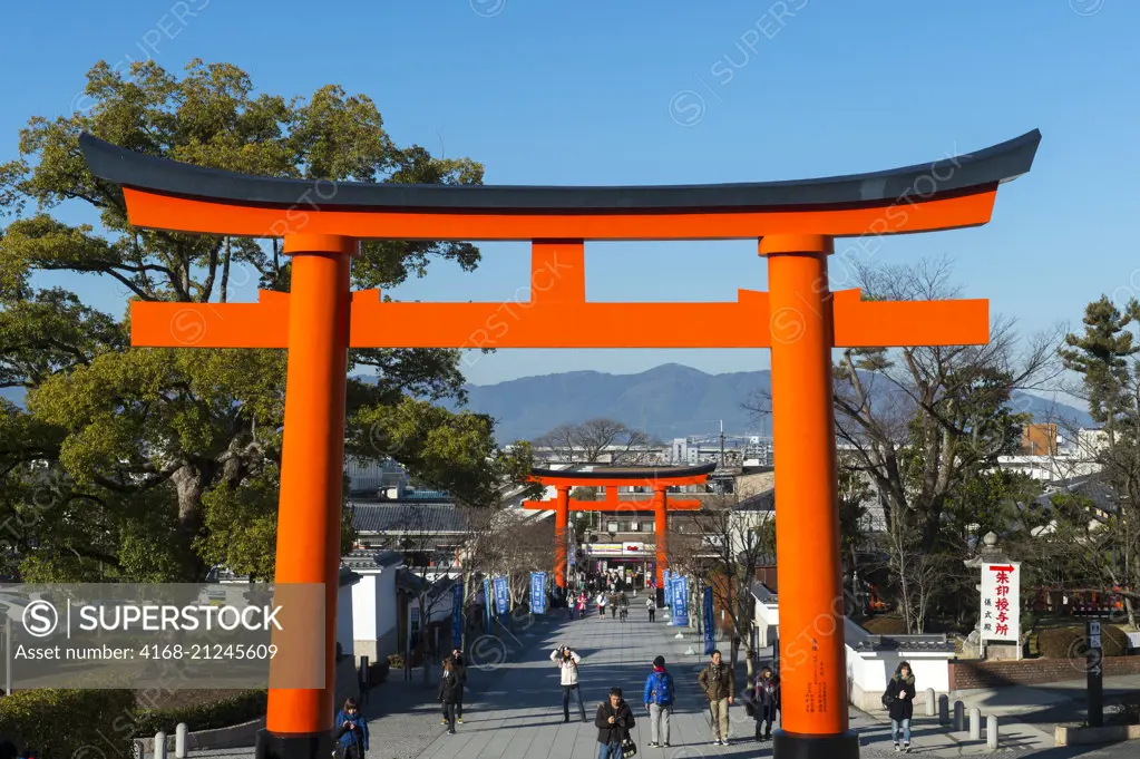 A tori gate at the entrance to the Fushimi Inari Taisha shrine, a Shinto shrine in Kyoto, Japan.