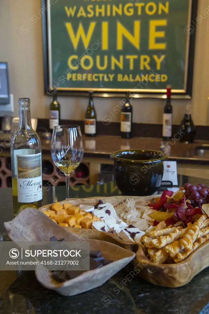 Snacks and wine bottles at Merry Cellars winery in Pullman in Whitman County in the Palouse, Washington State, USA.