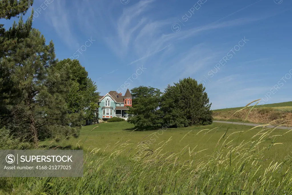 View of a Victorian style farmhouse near Pullman in Whitman County in the Palouse, Washington State, USA.