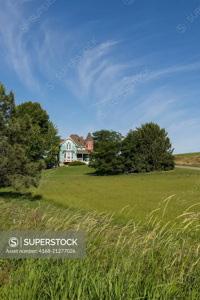 View of a Victorian style farmhouse near Pullman in Whitman County in the Palouse, Washington State, USA.