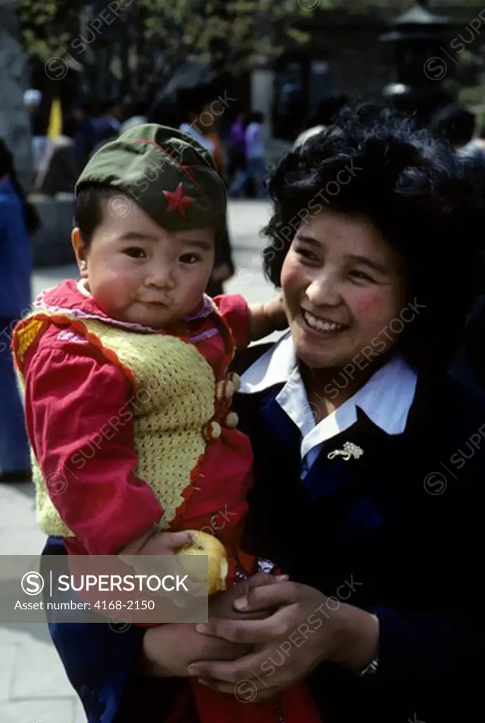 China, Beijing, Portrait Of Mother With Son