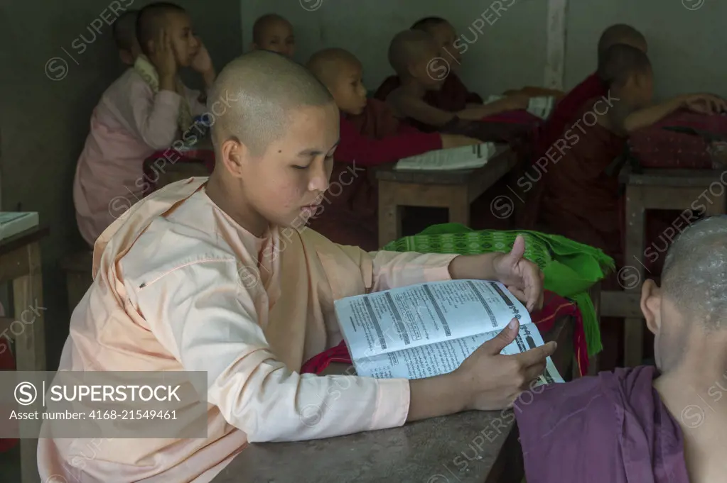 Students in a classroom at the public school of the Aungmyazoo Monastary in Sagaing, a town outside of Mandalay, Myanmar.
