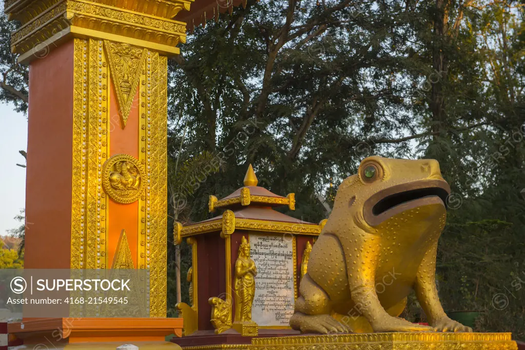 A statue of a golden frog at the entrance to Sagaing Hill in Sagaing, a town outside of Mandalay, Myanmar.