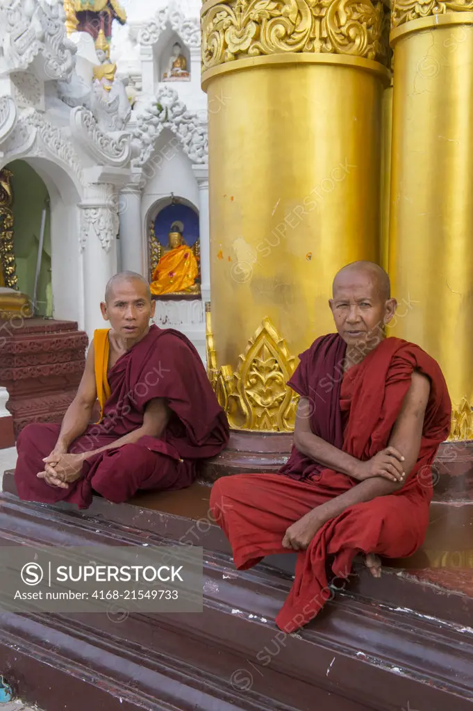 Buddhist monks (novices) at the 2,500 years old Shwedagon Pagoda in Yangon (Rangoon), the largest city in Myanmar.