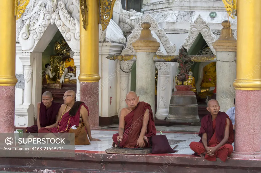 Buddhist monks (novices) at the 2,500 years old Shwedagon Pagoda in Yangon (Rangoon), the largest city in Myanmar.