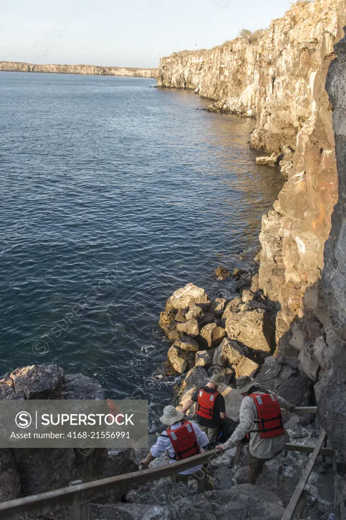Tourists on the Prince Philips Steps in a cliff on Genovesa Island (Tower Island) in the Galapagos Islands, Ecuador.
